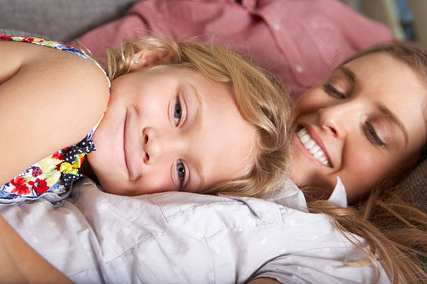istock Family Relaxing On Sofa Together 174955849
