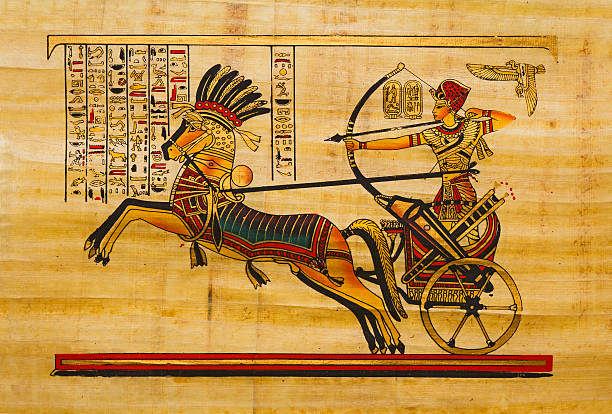 Egyptian ancient papyrus Pharaoh in the chariot. Egyptian ancient papyrus with with elements of egyptian history and religionSee more ART AND CRAFT images here: rameses ii stock illustrations