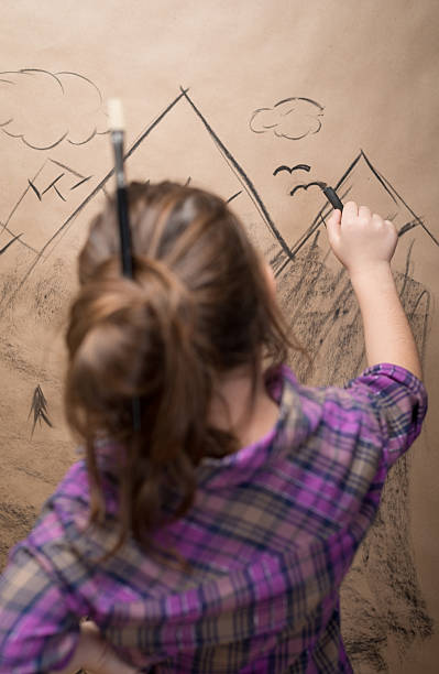 istock Little girl drawing with Charcoal 174956315
