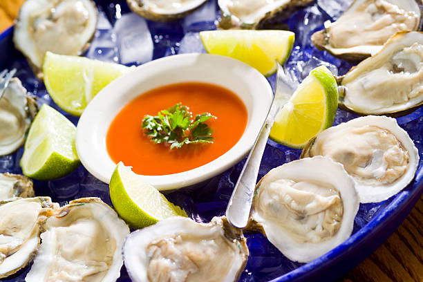 istock Fresh Raw Oysters on Ice with Garnish 174956448