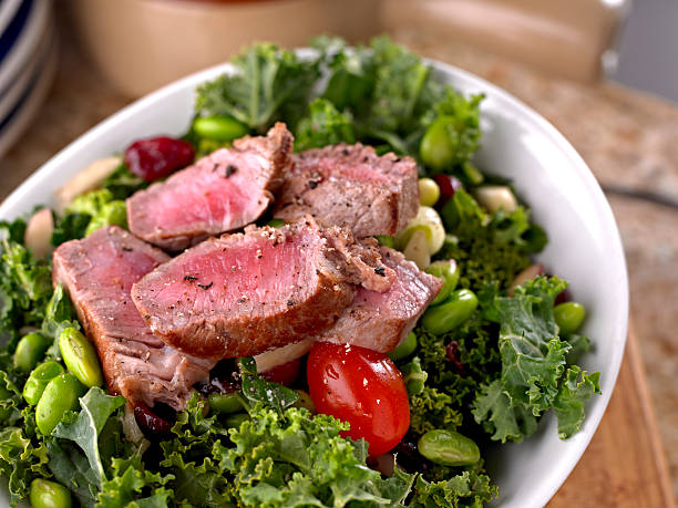 Fresh Salad with Roasted Beef "Fresh Salad with Bean ,Kale and Roasted Steak.Shot with Hasselblad." steak salad stock pictures, royalty-free photos & images