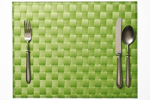 istock Isolated shot of place mat with silverware on white background 174956766