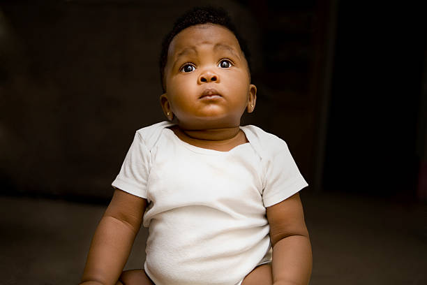 istock Baby girl looking up 174956896