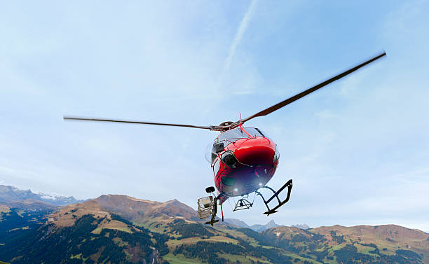 istock red rescue helicopter landing on mountain 174957200