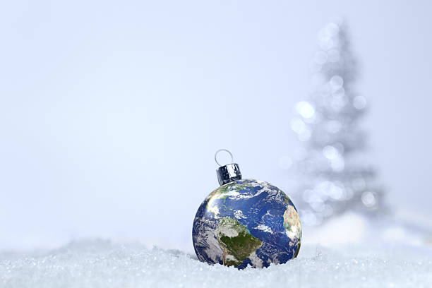 istock Earth globe ornament set in snow 174957209