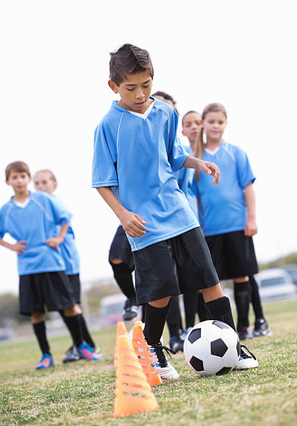 istock Young soccer player preparing to shoot free kick during game 174957279