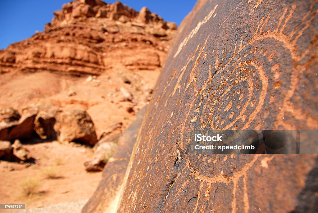 Ancient Petroglyph Rock Art "This glyph from the deserts of southern Utah represents either the sun, calendar, or inner strength. The image has a very shallow depth of field and plenty of room for design and copy." Ancient Stock Photo