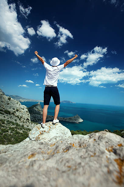 istock Man on peak of mountain 174957449