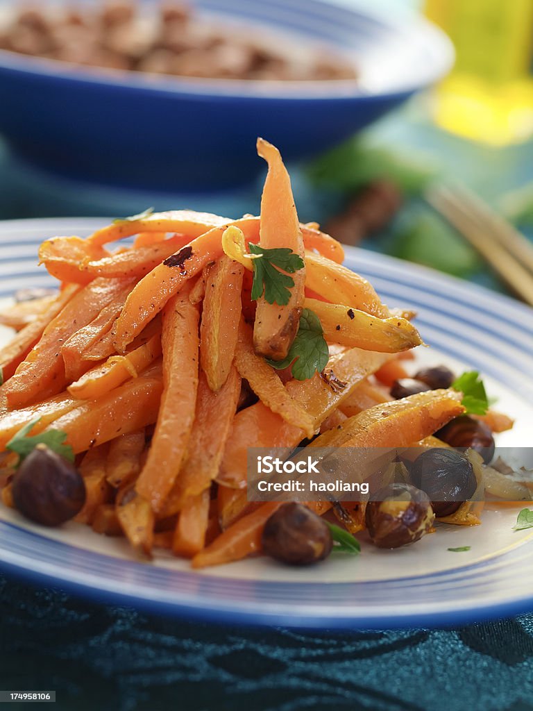 Hazelnut and Carrot Stir-fry "Toasted Hazelnut and Carrot Stir-fry  parsley for garnish.more food photos,Click my food lightbox please." Carrot Stock Photo