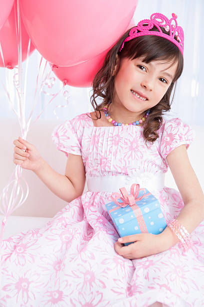 istock Excited birthday girl holding a gift 174958303