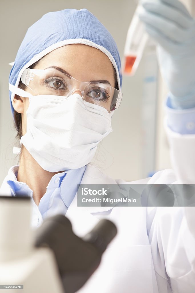 Scientist Working with Chemicals "Scientist Working with Chemicals,Researcher,Microscope, Lab,Test Tube" Accuracy Stock Photo