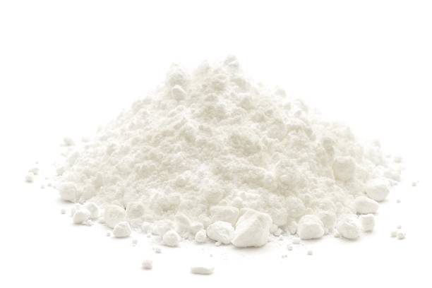 A small heap of icing sugar on a white background A  icing sugar, isolated on a white background. powdered sugar stock pictures, royalty-free photos & images