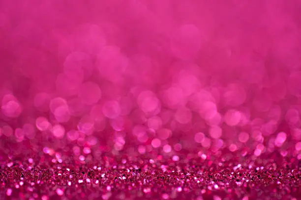 A glittery pink background with great copy space. You may also like: