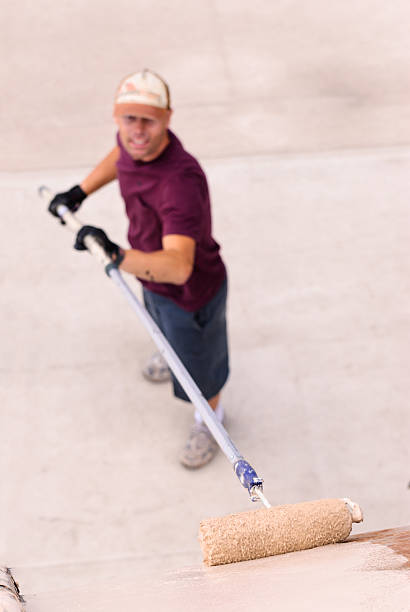 istock Painter Man Painting Building Exterior 174959220
