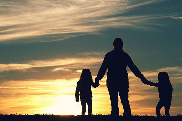 istock Family Walking at Sunset 174959236