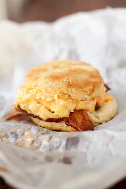 "A homemade breakfast biscuit with cheese, scrambled eggs, and bacon.View more of my"