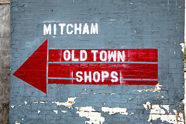 istock Sign and arrow on old building with peeling paint 174959339