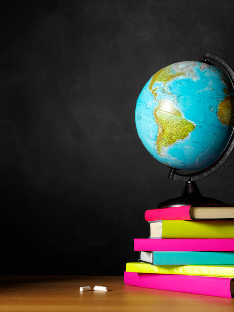 istock Desktop Globe on a Classroom Desk with Coloured Books 174959387