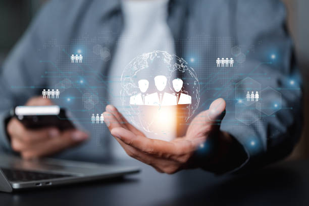 istock Businessman showing virtual graphic human icon HR human resources recruitment team Staff management business concept. 1749596232