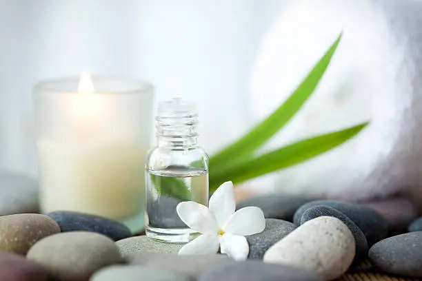 Photo of Candle-lit aromatherapy oil at spa