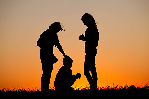 istock Silhouette of Children Praying 174960127