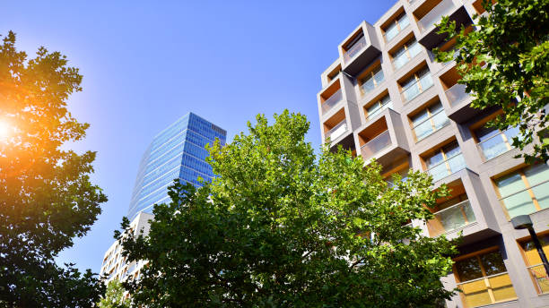 istock Modern apartment building and green trees. Ecological housing architecture. 1749602931