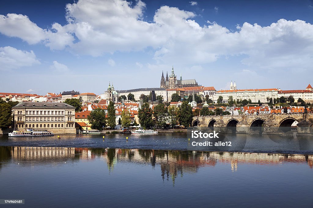 Charles Bridge and Saint Vitus Cathedral in Prague "St. Vitus Cathedral, Prague Castle and Charles Bridge over Vltava River." Architecture Stock Photo