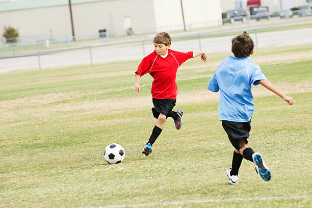 istock Boys playing during a youth soccer game 174960536