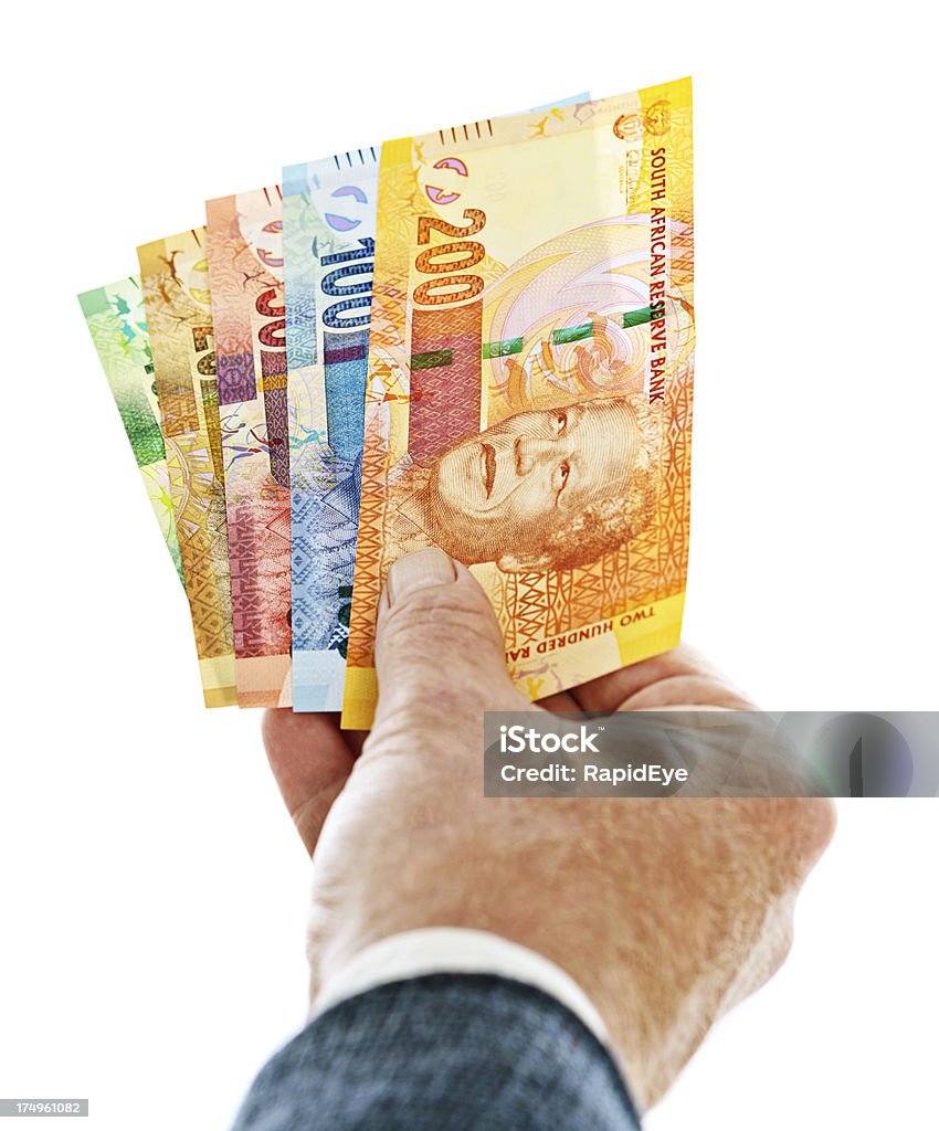 Male hand holding a set of new South African banknotes "A man's hands hold a bundle of the new South African banknotes, including all denominations (Ten, Twenty, Fifty, One Hundred and Two Hundred Rands) and all  featuring the iconic statesman Nelson Mandela. This is the complete set." Bundle Stock Photo