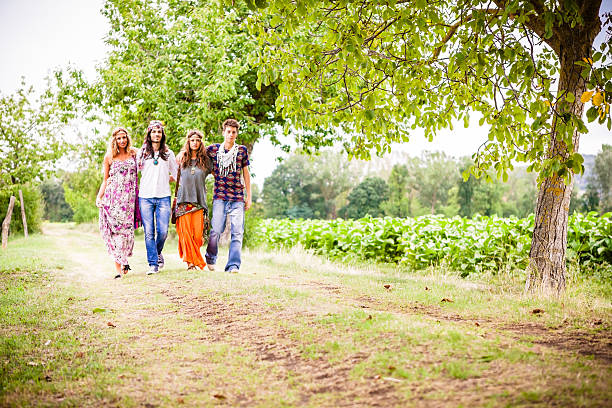 istock Group of Hippies Walking on a Natural Path 174961590