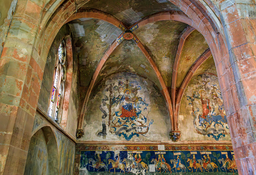 Strasbourg, France - May 31, 2023: Gothic Revival mural frescoes in the nave of Saint Pierre le Jeune Protestant church on Grande Ile, historic center