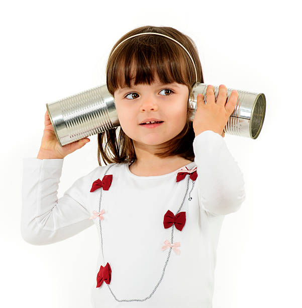 istock girl with tin can phone 174962153
