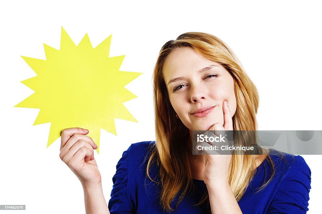 Cute blonde teenager considers blank sign she holds, smiling "A cute blonde teenager smiles,her hand to her chin ,as she considers the blank yellow star shape she is holding, ready for your message." Adult Stock Photo