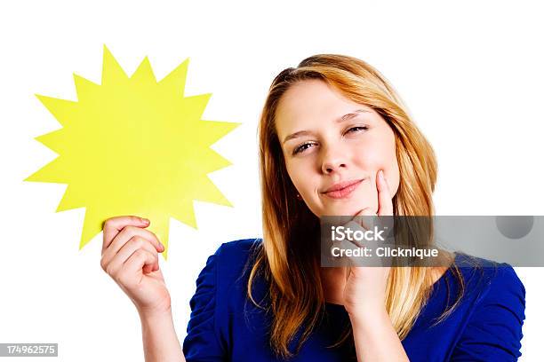 Cute Blonde Teenager Considers Blank Sign She Holds Smiling Stock Photo - Download Image Now
