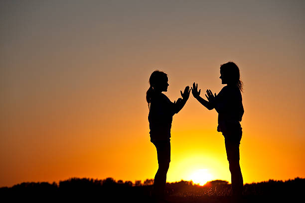 istock Two Young Girls Playing at Sunset 174962955