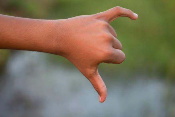 istock A man shows his two finger and a blurred background 1749630824