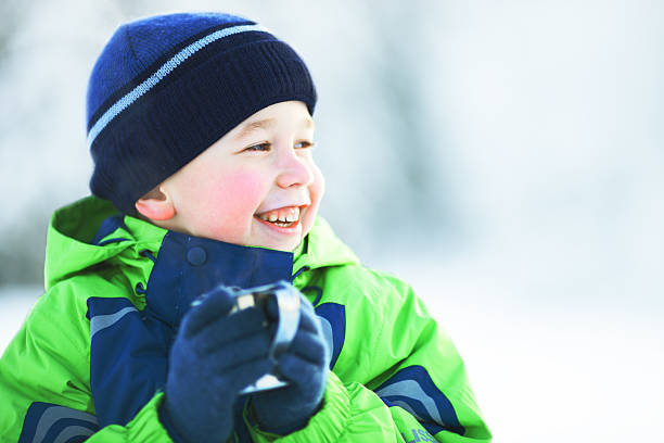 istock Boy drink hot tea in winter forest 174963387