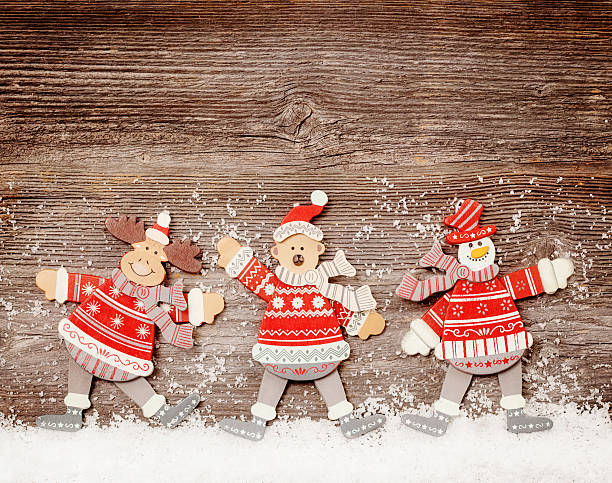Funny toys on wooden background with snow