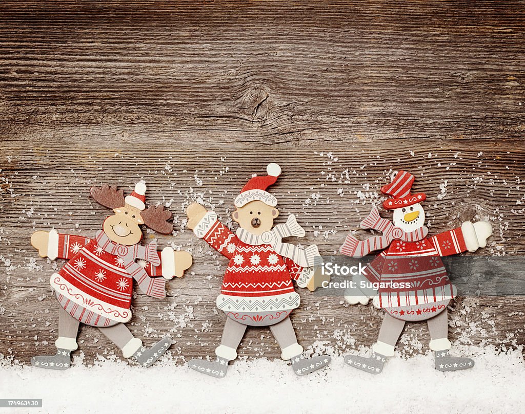 Funny toys on wooden background Funny toys on wooden background with snow Christmas Stock Photo