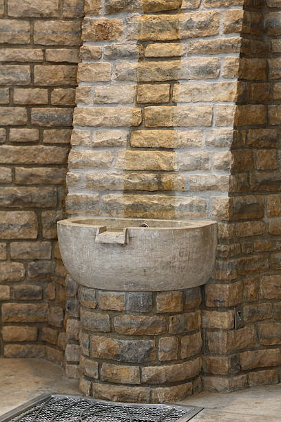 istock Baptismal font at Catholic Church. 174964298