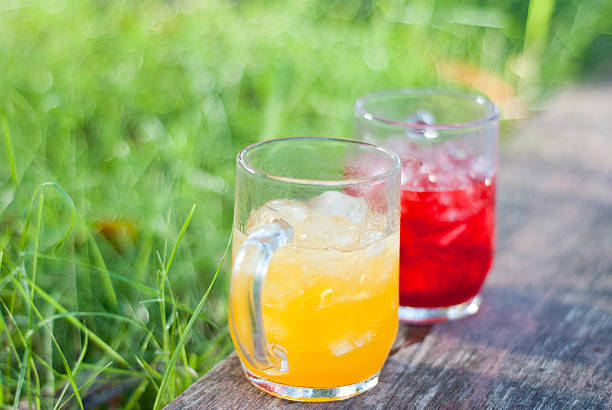 istock fresh juice by green grass 174964635