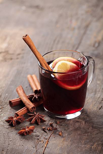 Mulled wine Mulled wine and spices on wooden background. Selective focus. mulled wine photos stock pictures, royalty-free photos & images
