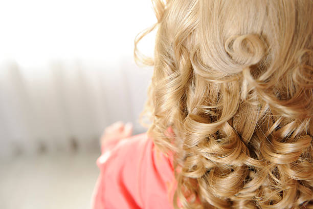 curly blond hair rear view of blond curly hair. ringlet stock pictures, royalty-free photos & images