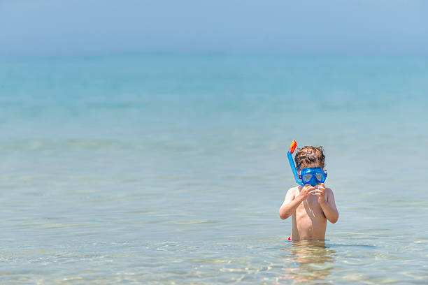 istock Little snorkeler putting mask on 174965075