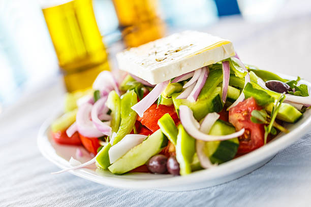 Original Greek salad close-up in restaurant. Shallow DOF, selective focus.