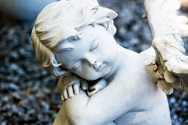 Photo of Staue of sleeping little angel - cherub