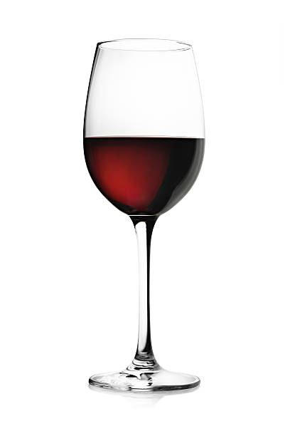 Red Wine in Wineglass Close up of a wineglass semi full with red wine isolated on white.Related pictures: deep focus stock pictures, royalty-free photos & images