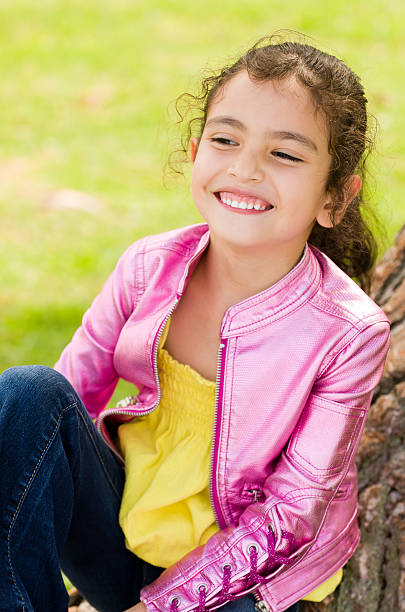 Little Girl with a Pink Shiny Jacket stock photo