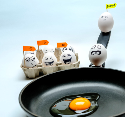 scared egg preparing to jump in pan and jury according grades.