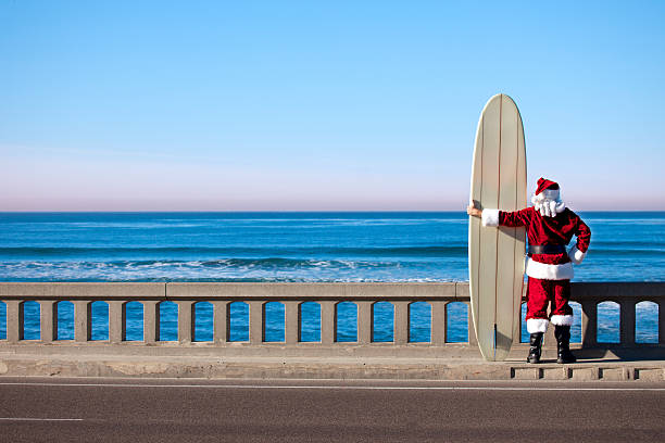 Santa on Vacation This is a conceptual photo relating to taking a Christmas vacation.Click on the links below to view lightboxes. sunset blue beach san diego california stock pictures, royalty-free photos & images